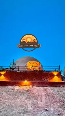 a domed building with a dome in the background at RUM SUNSET BUBBLES lUXURY CAMP in Wadi Rum