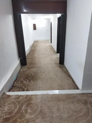 a hallway of an office building with a carpeted floor at شقة مفروشة في عجلون رأس منيف in Ajloun