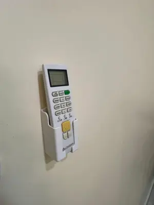a remote control is attached to a wall at Petra 555 Rooms & Apartment in Wadi Musa