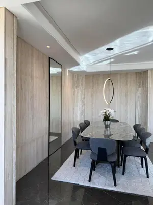 a dining room with a table and chairs at Dabouq Luxurious Penthouse in Amman