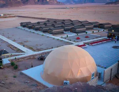 a large domed building in the middle of a desert at Rum Pillars Camp in Disah