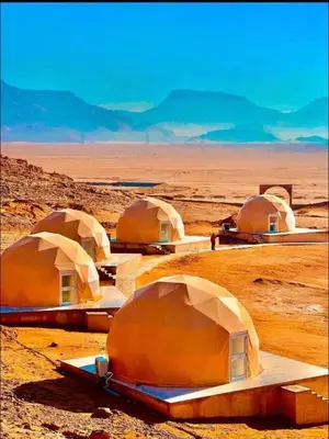 a group of domes in the middle of a desert at Rum Pillars Camp in Disah