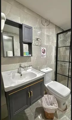 a bathroom with a sink and a toilet at RUM ELEGANCE BUBBLE lUXURY CAMP in Wadi Rum