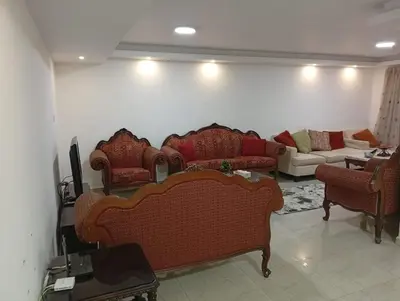 a living room with couches and a couch at Misk Home in Amman
