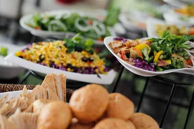 a table topped with plates of food and bowls of food at Meneur Hotel in Amman