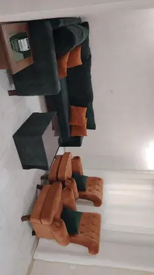 a bunch of brown ties on a wall at Al Wesam Furnished Apartments in Aqaba