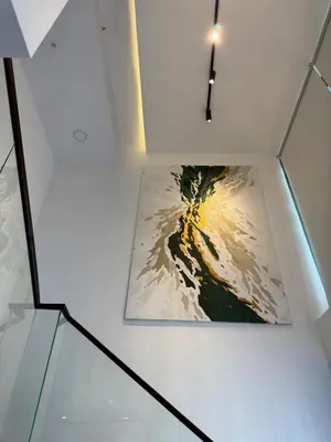 a picture in a white box with a painting on it at DAMAC City View Penthouse in Amman