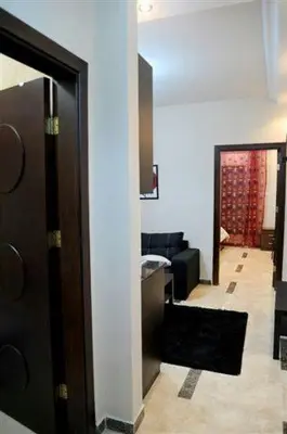 a room with a door to a living room at سامر برهم للاسكان in Amman