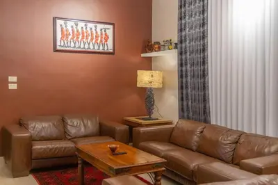 a living room with a couch and a table at High-end Apartment 2BDR in The most lively AMMAN شقة فاخرة في الدوار السابع in Amman