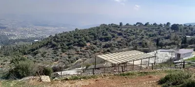 a building on top of a hill with a mountain at Offgrid Jerash-Ajlune MountainView Studio Shalea شاليه استوديو جبال جرش in Jerash