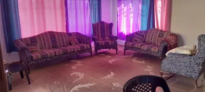 a living room with two chairs and a couch at Offgrid Jerash-Ajlune MountainView Studio Shalea شاليه استوديو جبال جرش in Jerash