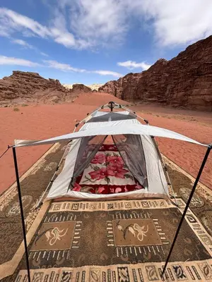 a tent in the middle of the desert at Wadi Rum Paris Cave in Wadi Rum