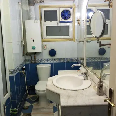 a bathroom with a sink and a toilet and a mirror at Noplity bed and breakfast in Al Qunayţirah