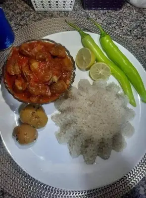 a plate of food with rice and vegetables on a table at الطل هاوس in Ar Rashādīyah