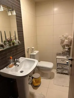 a bathroom with a sink and a toilet at الطل هاوس in Ar Rashādīyah