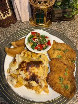 a plate of food on a table with a plate of food at الطل هاوس in Ar Rashādīyah