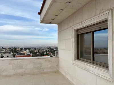 a balcony with a view of a city at شقه مفروشة ذات اطلالة جميلة ومكان هادئ in Irbid