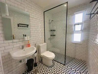 a bathroom with a toilet and a sink at Old Town Charming Two-Bedroom Flat in Amman