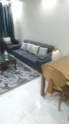 a living room with a couch and a chair at الجفر موتل in Al Jafr