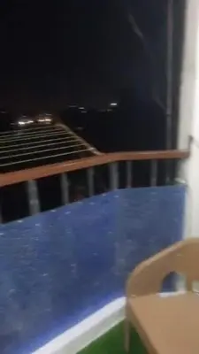 a bed in a room with a blue floor at الجفر موتل in Al Jafr