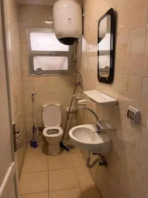 a small bathroom with a toilet and a sink at الجفر موتل in Al Jafr