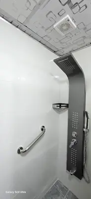 a shower in a bathroom with a shower at Balcony Hotel in Amman