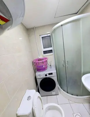 a bathroom with a toilet and a sink and a mirror at Falcon Real Estate in Amman