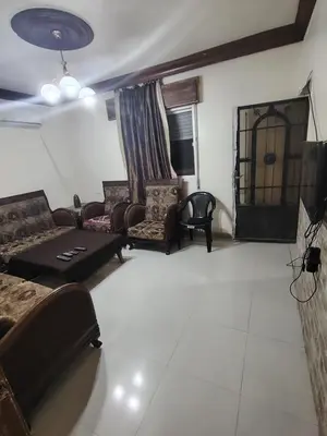 a living room with couches and chairs and a table at شقة مفروشة مدخل مستقل in Jurf ad Darāwīsh