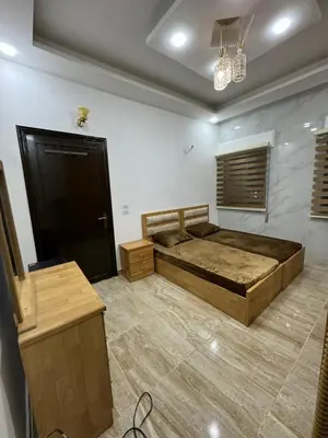 a bedroom with a large bed in a room at Seventh circle stay - Cozy &Chic in Amman