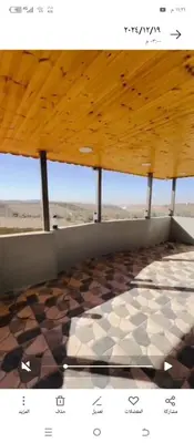 a room with a checkered floor and a wooden ceiling at فيلا الاحلام in Irbid
