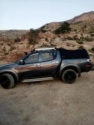 a car parked on the side of a dirt road at Dana Hiking Camp - Dana Nature Reserve in Dana