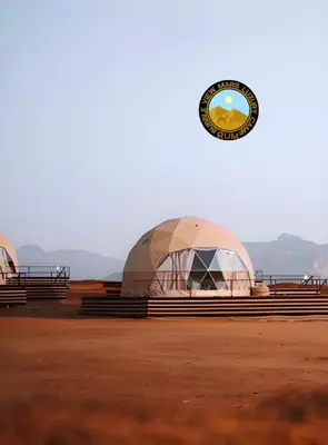 a domed building with a clock on top of it at RUM BUBBLES VIEW MARS lUXURY CAMP in Wadi Rum