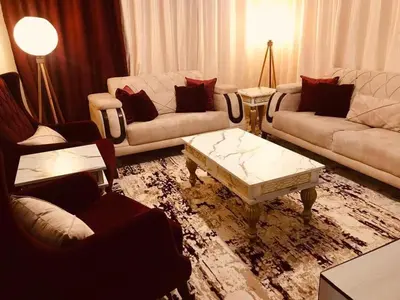 a living room with two couches and a coffee table at July house in Wadi Musa