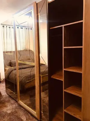 a room with a glass closet with a bed at July house in Wadi Musa