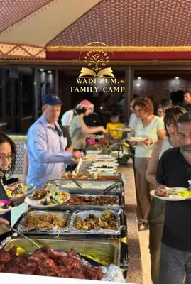 a buffet line with many plates of food on it at RUM FAMiLY BUBBLES &BEDOUIN CAMP in Wadi Rum