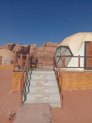a stairway leading to a building in the desert at calm Rum in Wadi Rum