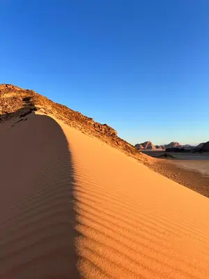 a sand dune in the middle of the desert at Luxury Desert Camp in Disah