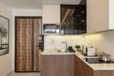 a kitchen with a sink and a counter top at Shamsi Apartments 223 in Amman