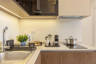a kitchen with a sink and a counter top at Shamsi Apartments 223 in Amman