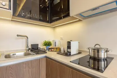 a kitchen with a sink and a counter top at Shamsi Apartments 223 in Amman