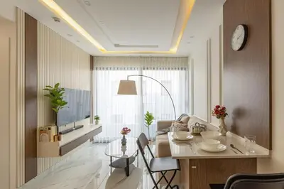 a living room with a table and a couch at Shamsi Apartments 330 in Amman