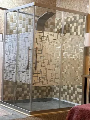 a shower with a glass enclosure in a room at DeadSea studio in Sowayma