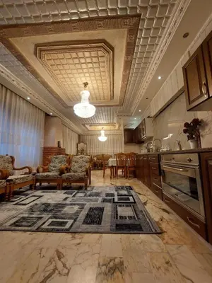 a large room with a kitchen and a living room at شقة مفروشة في البنيات - بالقرب من جامعة البتراء in Amman