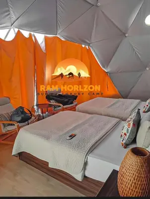 a room with a bed in a tent at RAM HORlZON LUXURY CAMP in Wadi Rum