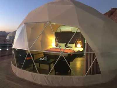 a small tent with a bed inside of it at Al-Faris Camp in Disah