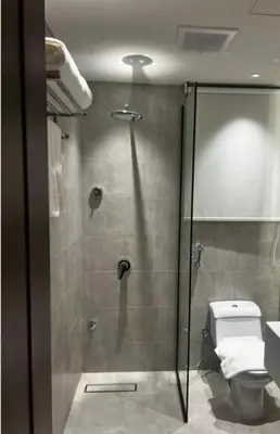 a bathroom with a shower and a toilet at asfouer Hostel in Muqbilah
