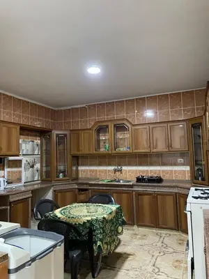 a kitchen with a table and chairs in it at zainab bedouin house in Petra