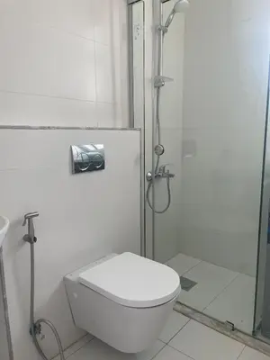 a bathroom with a toilet and a shower at Premium 1BR Furnished Apartment in Amman