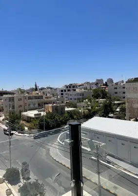 a view of a city with a street and buildings at Premium 1BR Furnished Apartment in Amman