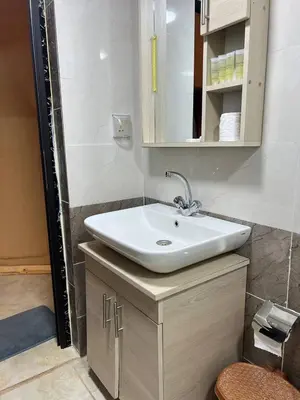 a bathroom with a sink and a mirror at Gakleen luxury camp in Aqaba